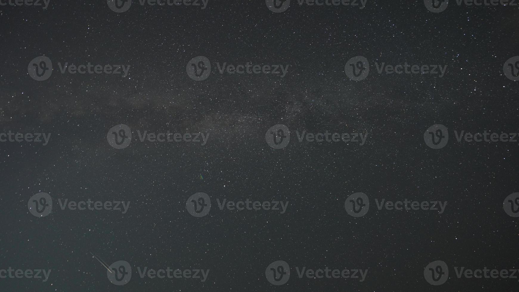 The dark night sky view with the milkyway as the background photo