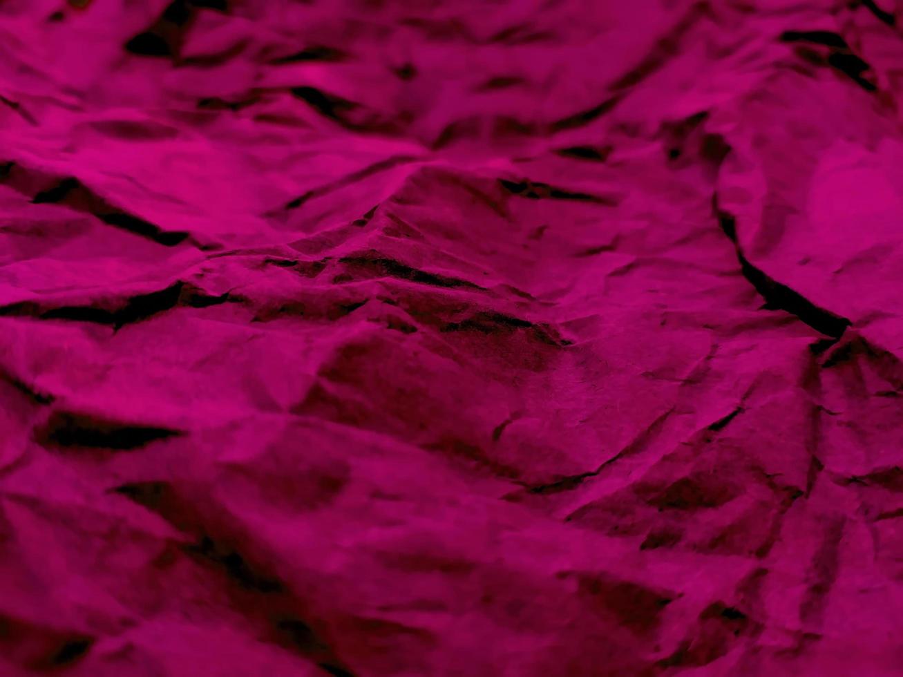 Background of a sheet of red crumpled paper. photo