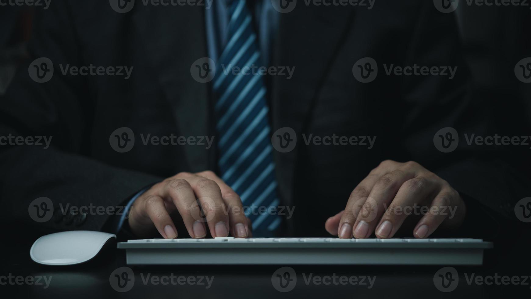 Business man using keyboard computer on desk. photo