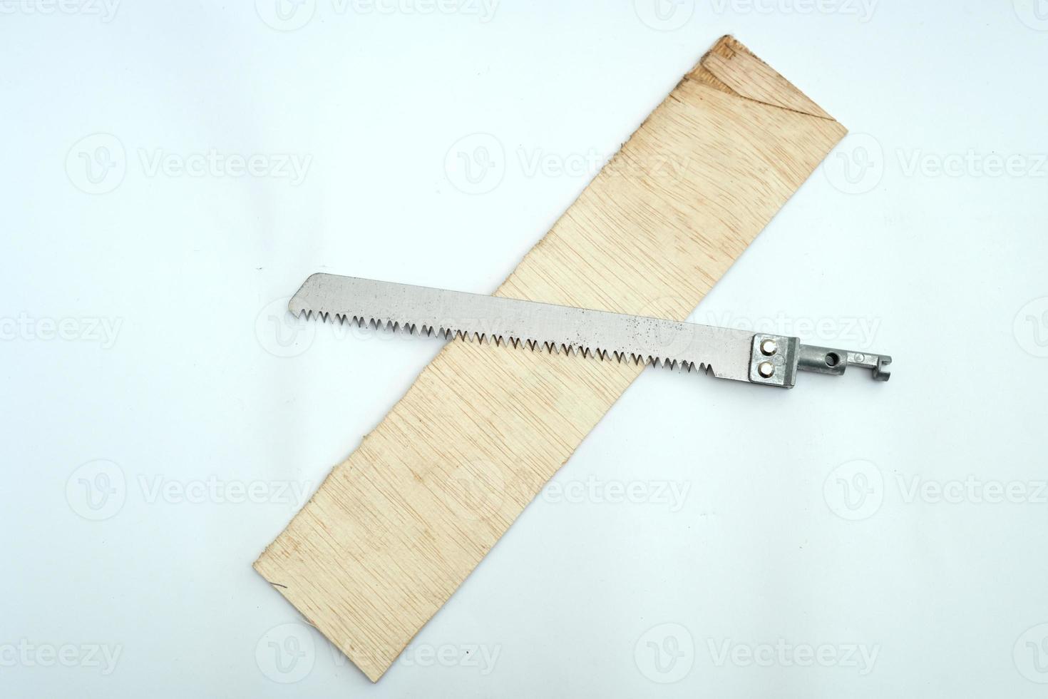 Wood cutting saw for making crafts on a white background photo