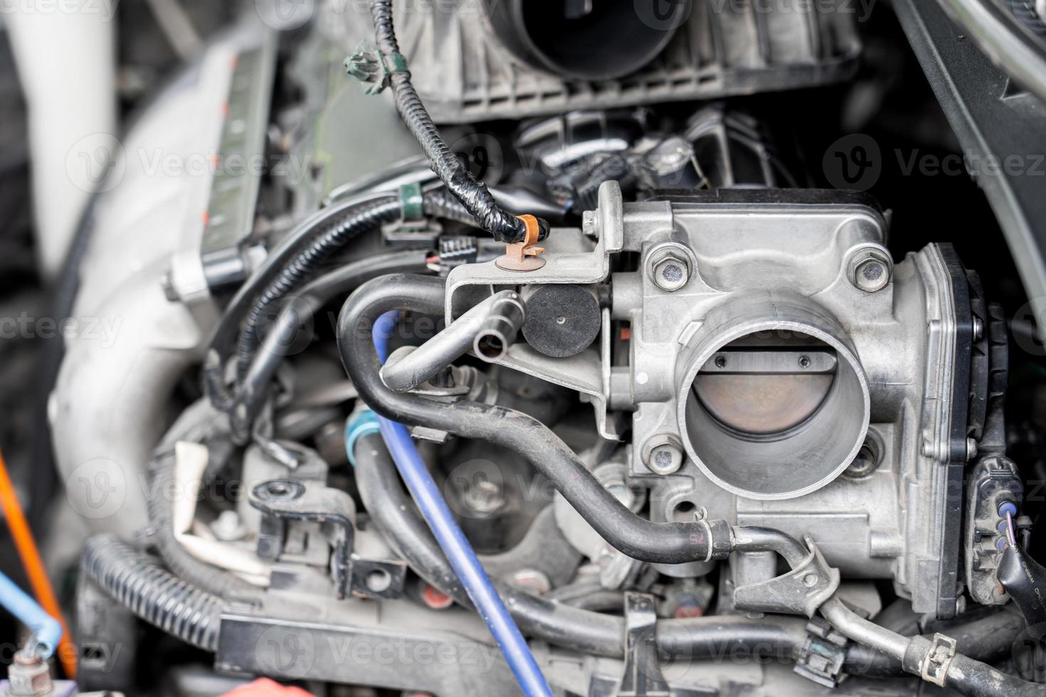 Close up old throttle Body of car in engine room with dust and Soot for repair and clean in process with engine room photo