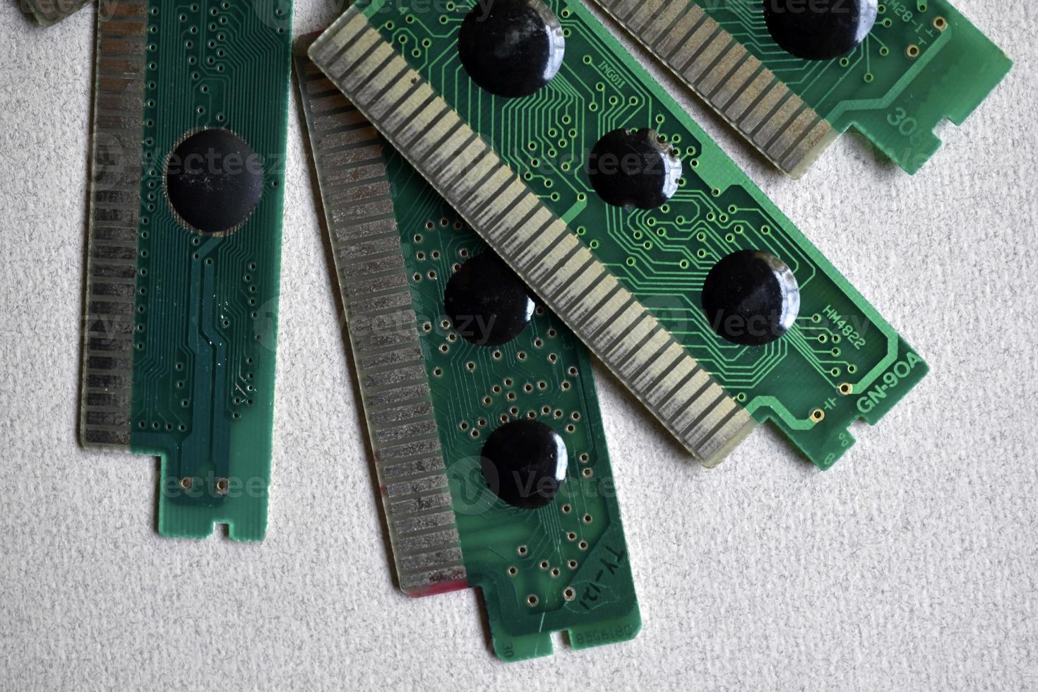 Old electronic boards for retro games. Cartridges for retro game consoles. photo