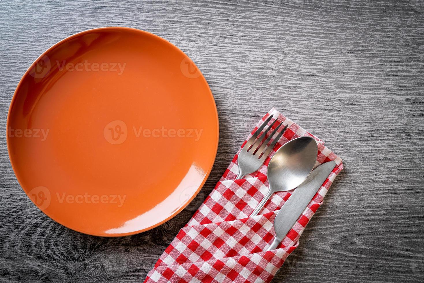 empty plate or dish with knife, fork and spoon photo