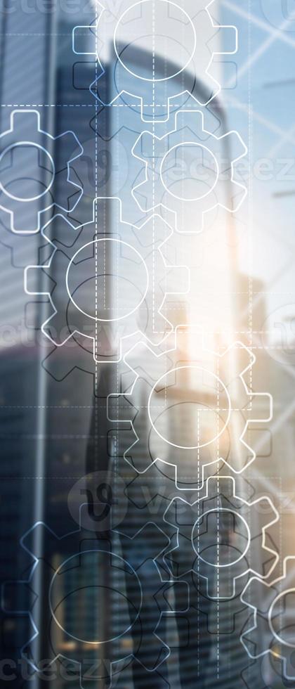 Vertical Panorama Banner. Double exposure gears mechanism on blurred background. Business and industrial process automation concept. photo