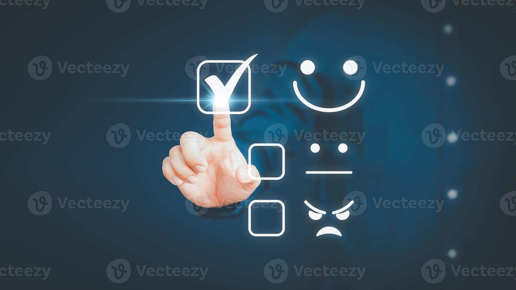 Man touching the virtual screen on the happy smiley face icon to give satisfaction in service. Rating very impressed. Customer service,  testimonial satisfaction concept. photo