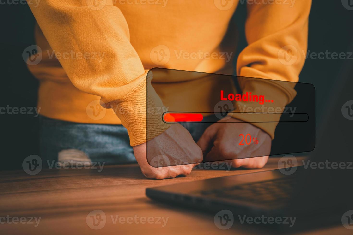 Man using laptop for download and waiting to loading digital business data form website, concept of waiting for load of loading bar. photo