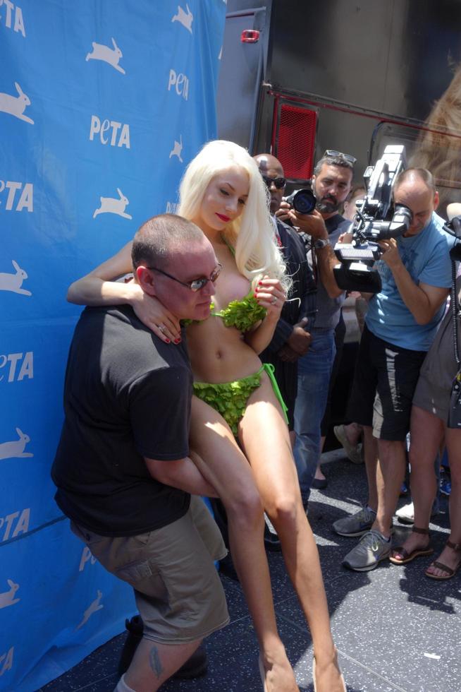 LOS ANGELES, JUL 31 - Doug Hutchison, Courtney Stodden at the PETA Pink s Veggie Hot Dog Event at the Hollywood and Highland on July 31, 2013 in Los Angeles, CA photo