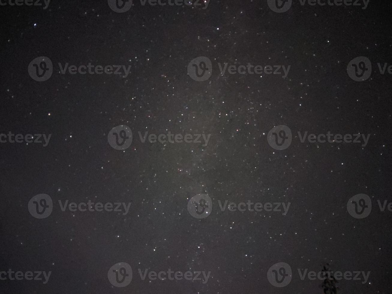 Bright night starry sky in the village photo