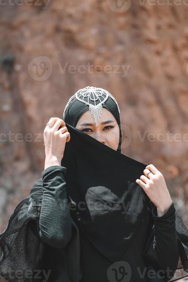 Muslim Woman Pose at the Desert, Close-Up photo