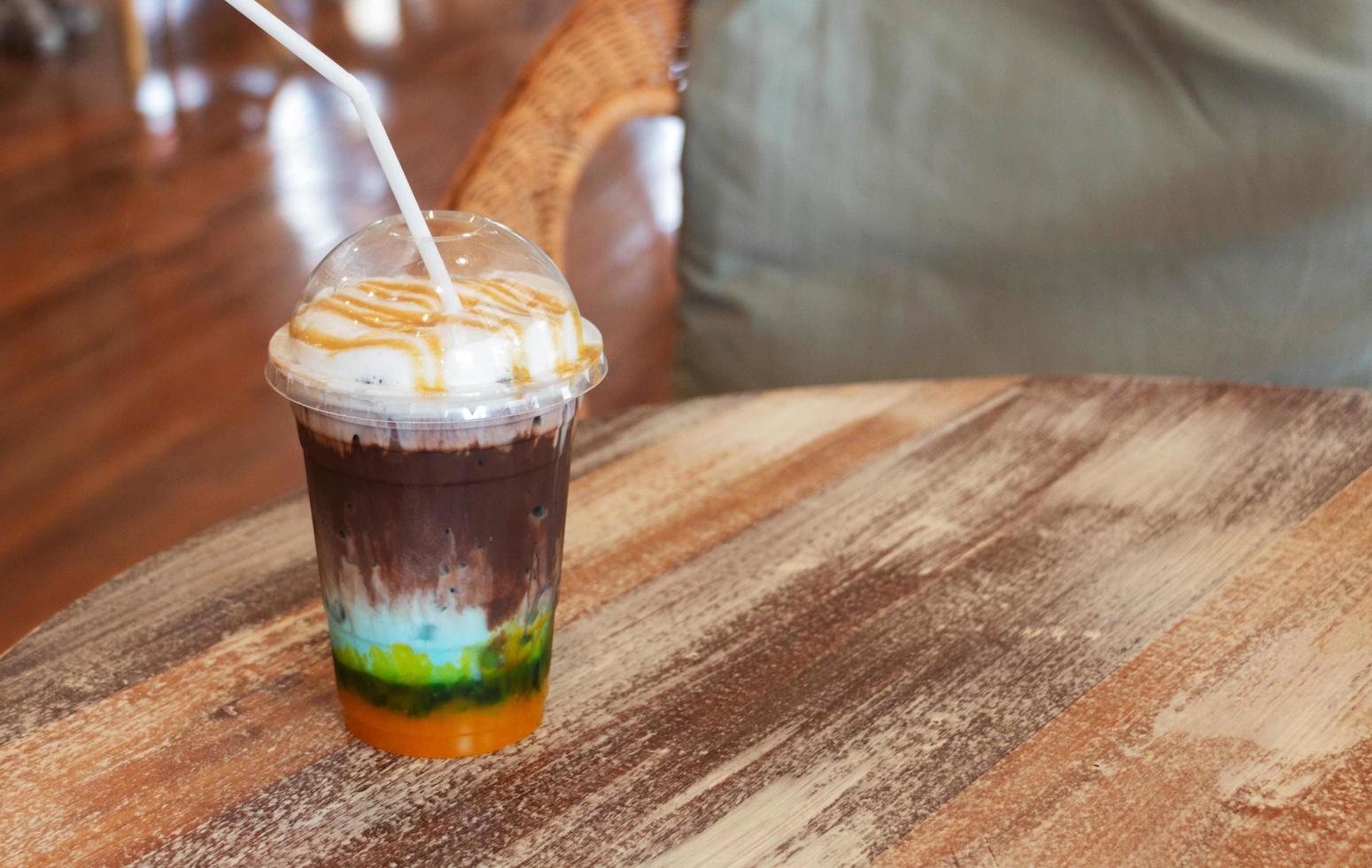 colorful cold mixed cocoa on wooden table photo