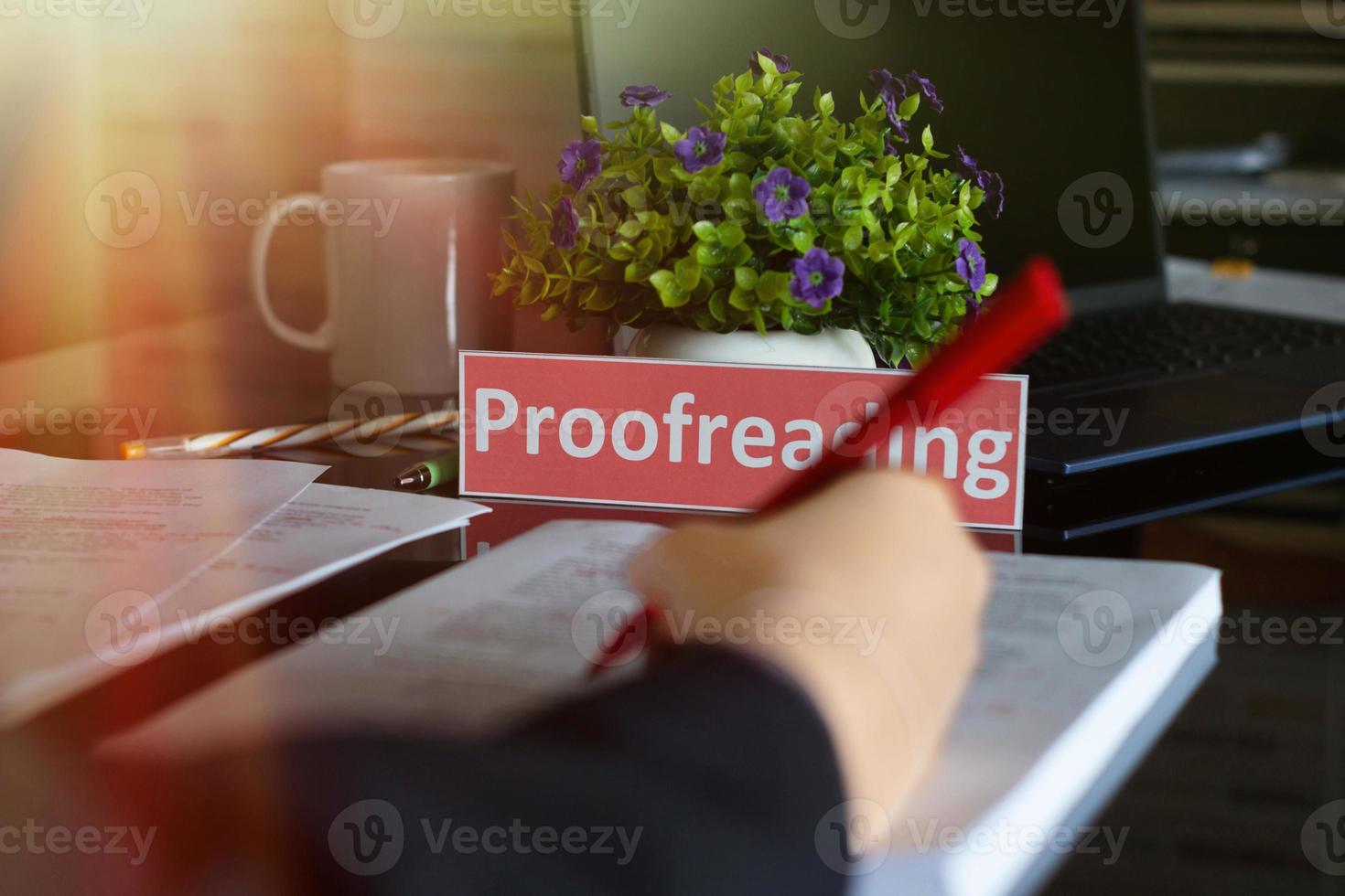 proofreading English card on black table photo