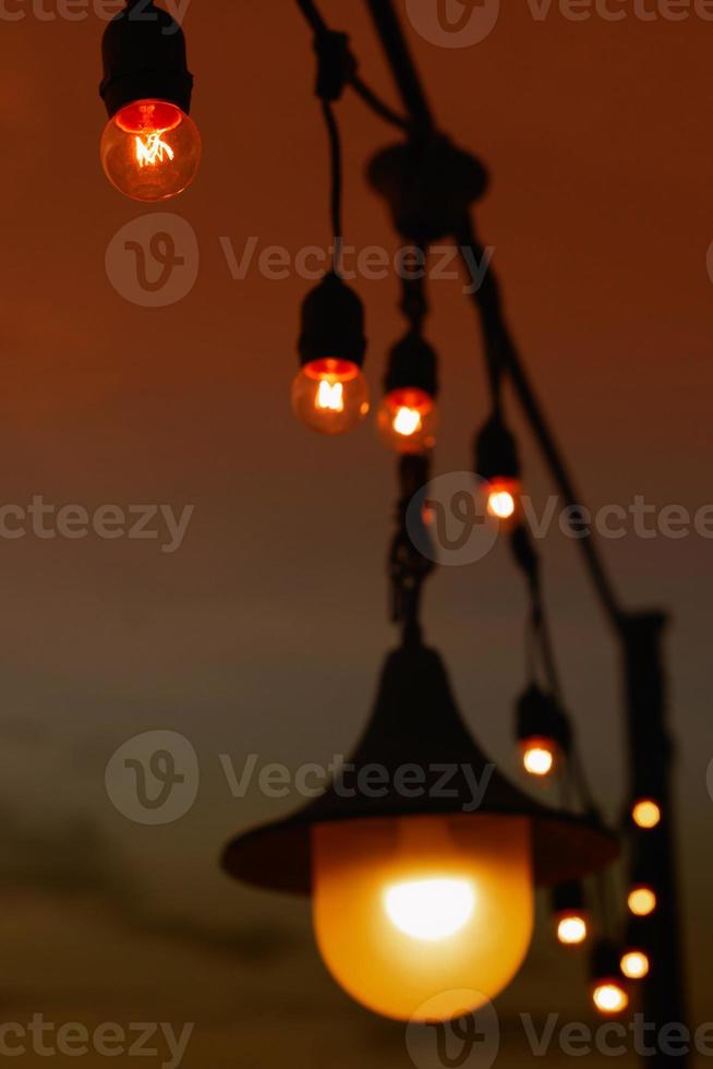 electric light bulb hanging on wire photo