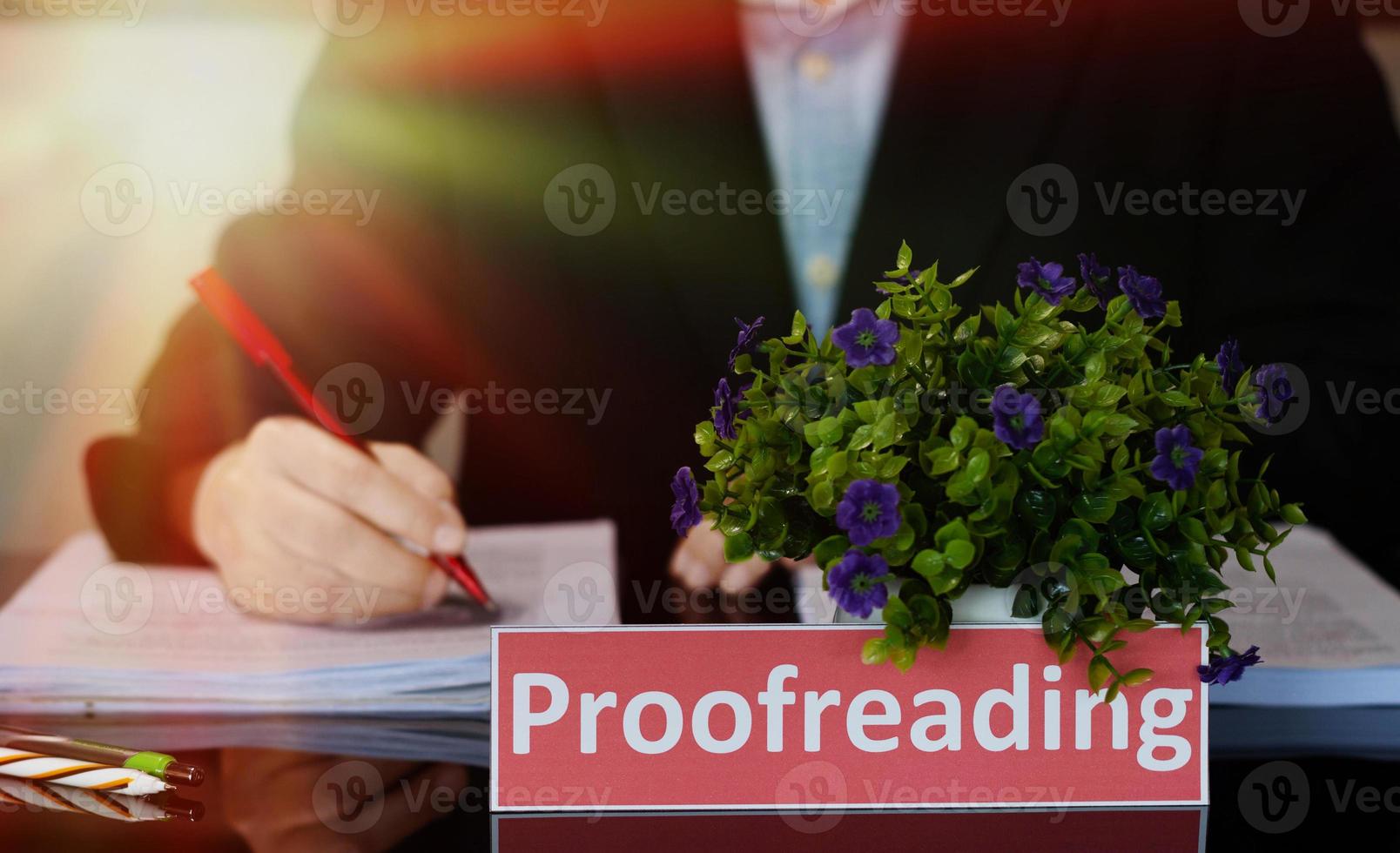 proofreading English card on black table photo