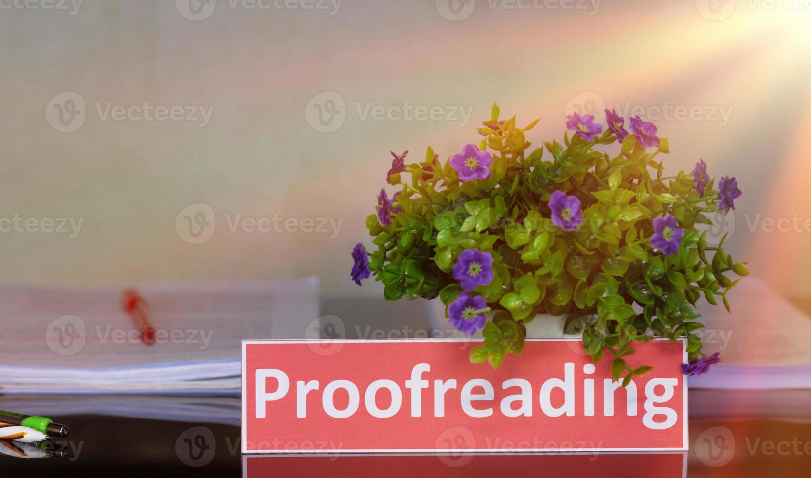proofreading English card on black table photo