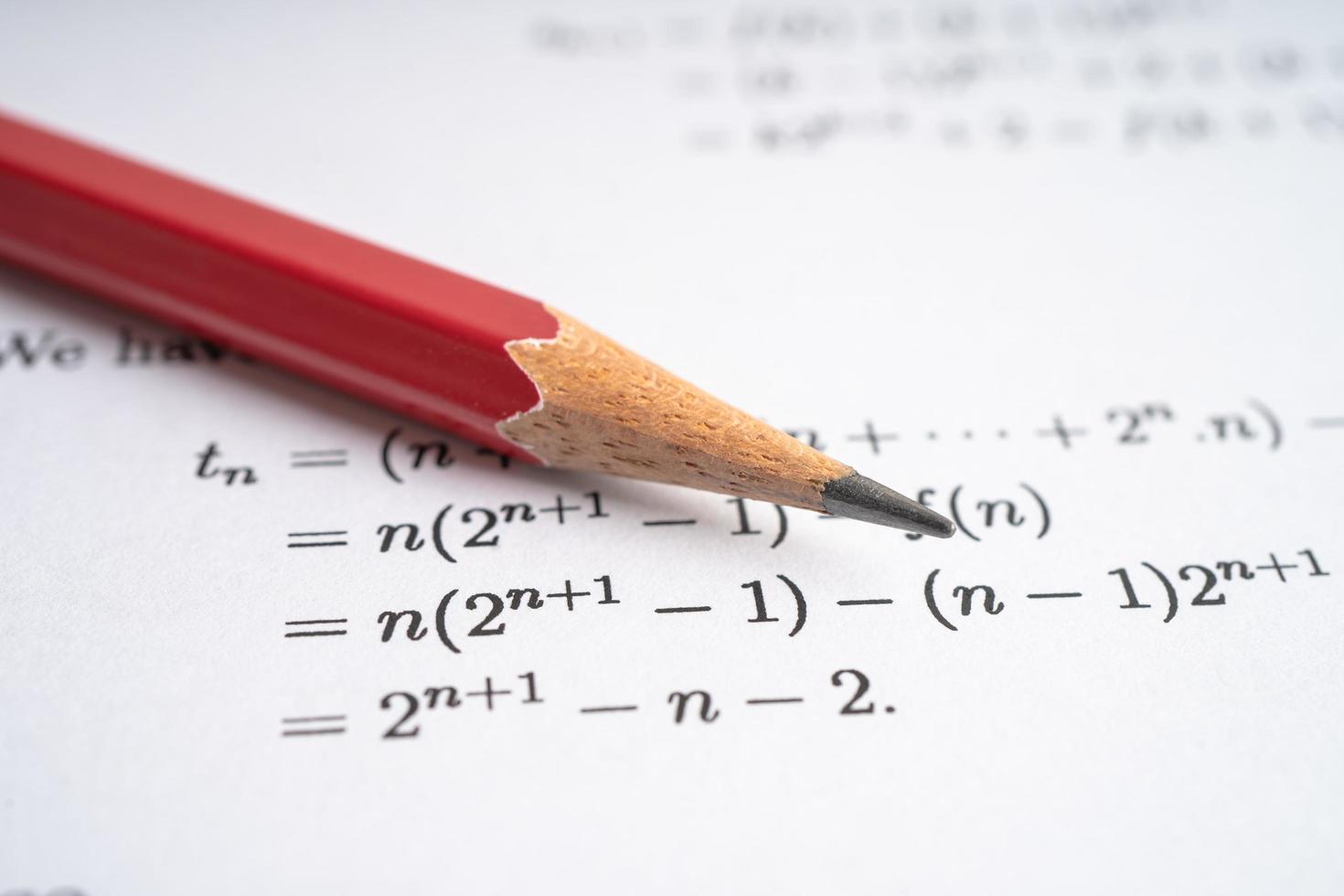 Pencil on mathematic formula exercise test paper in education school. photo