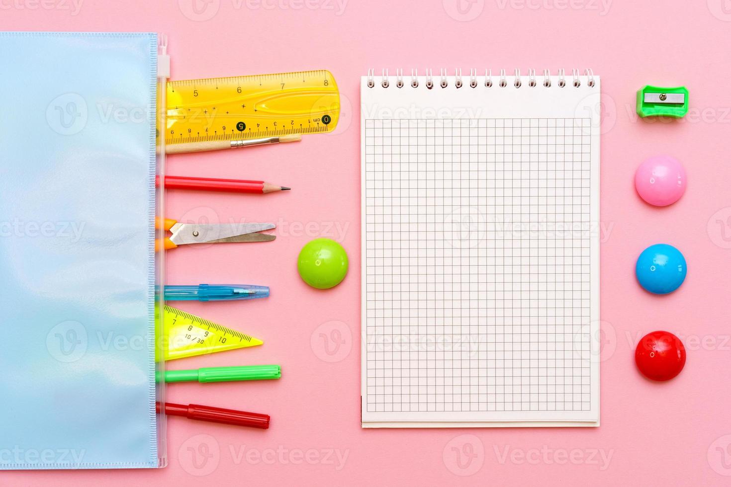 School notebook and various office supplies. Back to school concept photo