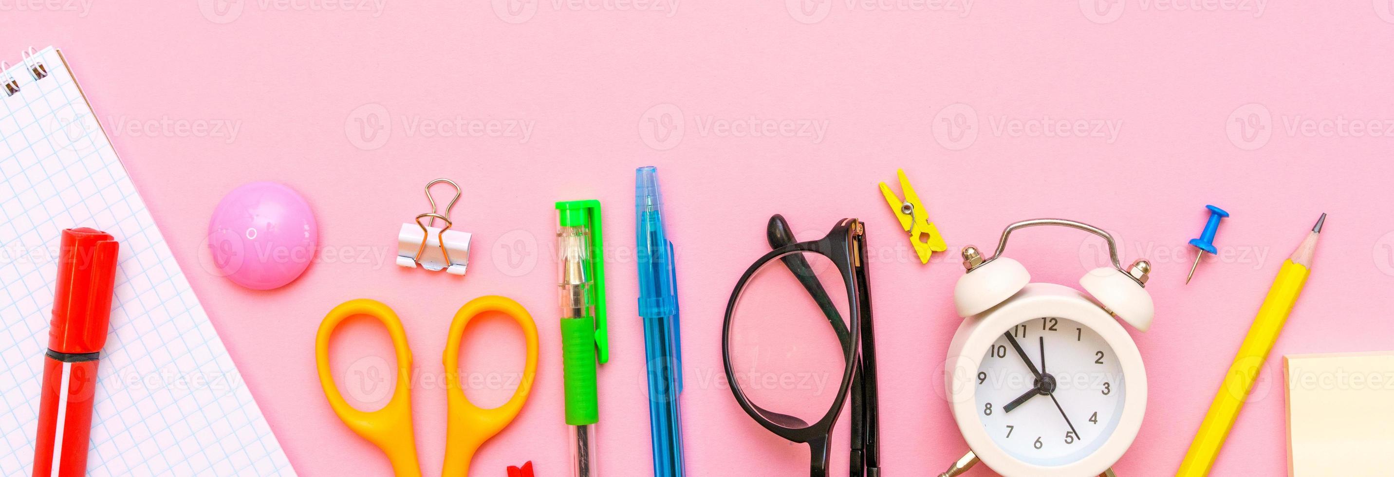 School supplies on a pink background. Back to school creative illustration photo