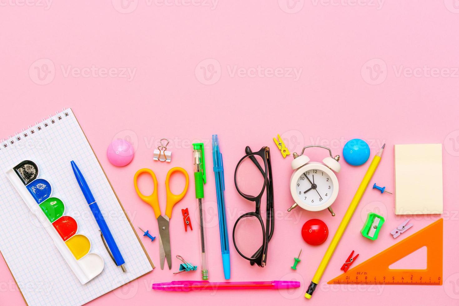 School supplies on a pink background. Back to school creative illustration photo