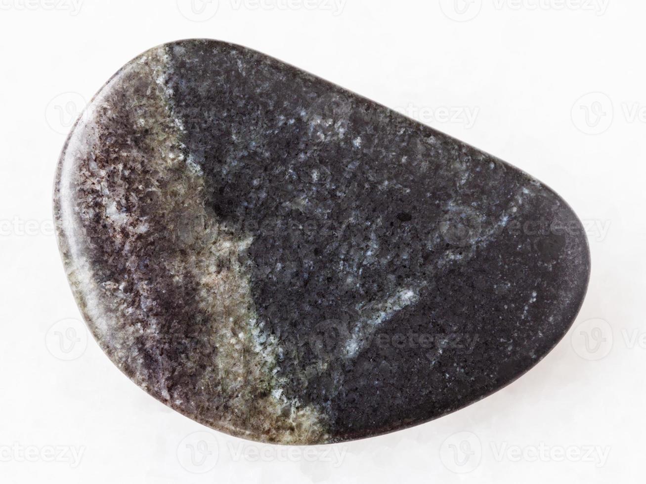 polished olivinite stone on white photo