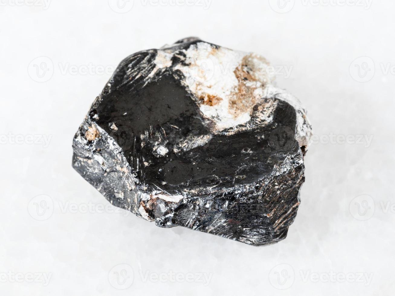 rough Hematite crystal on white photo