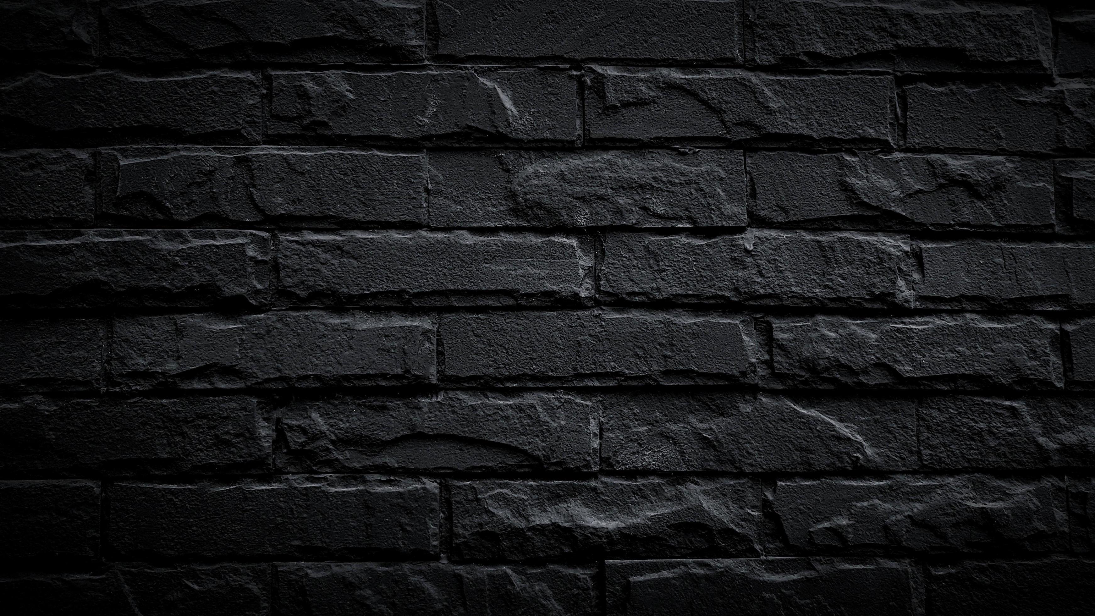 Black brick wall for background. Pattern of brickwork wallpaper and