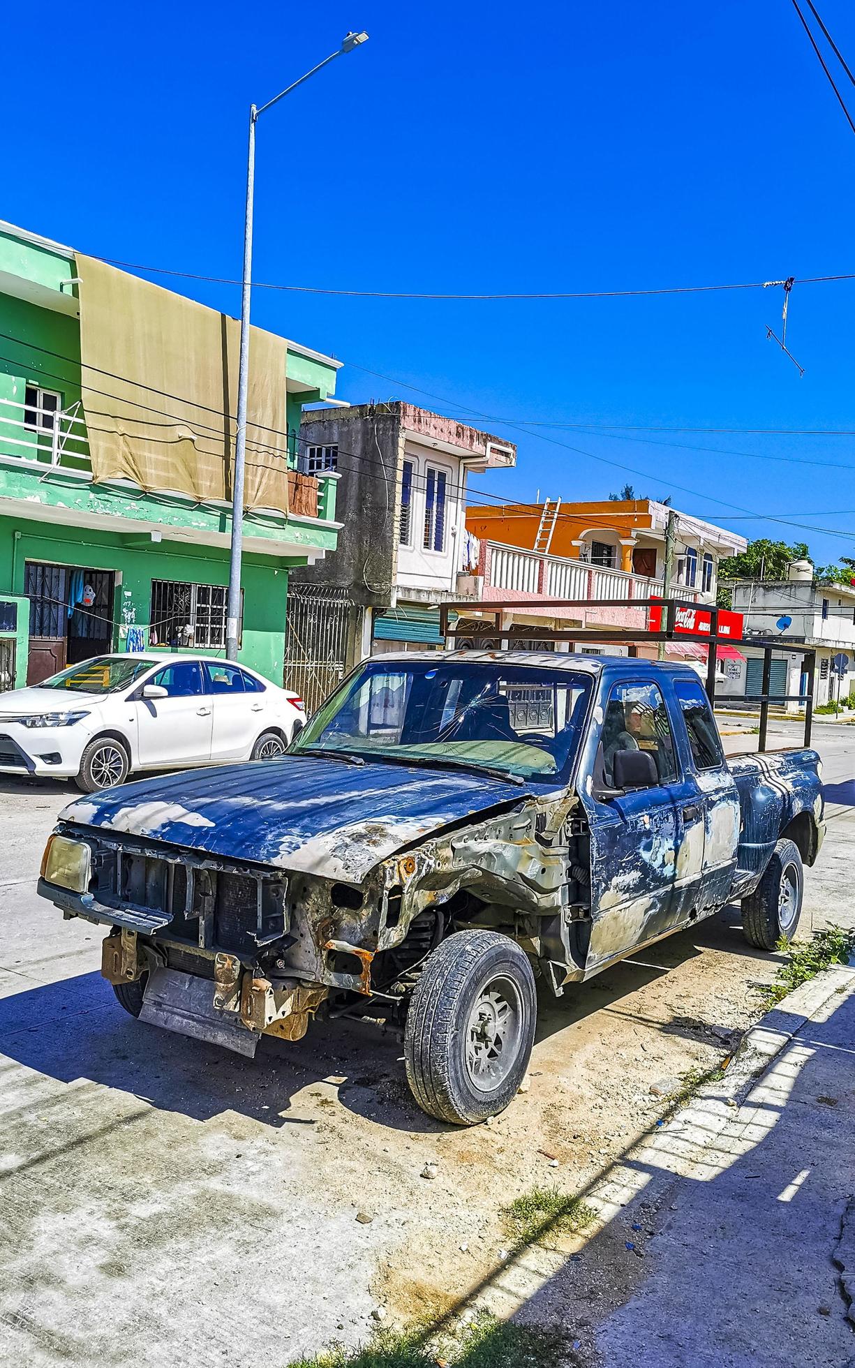 Playa del Carmen Quintana Roo Mexico 2022 Broken scrap tire rustic cars