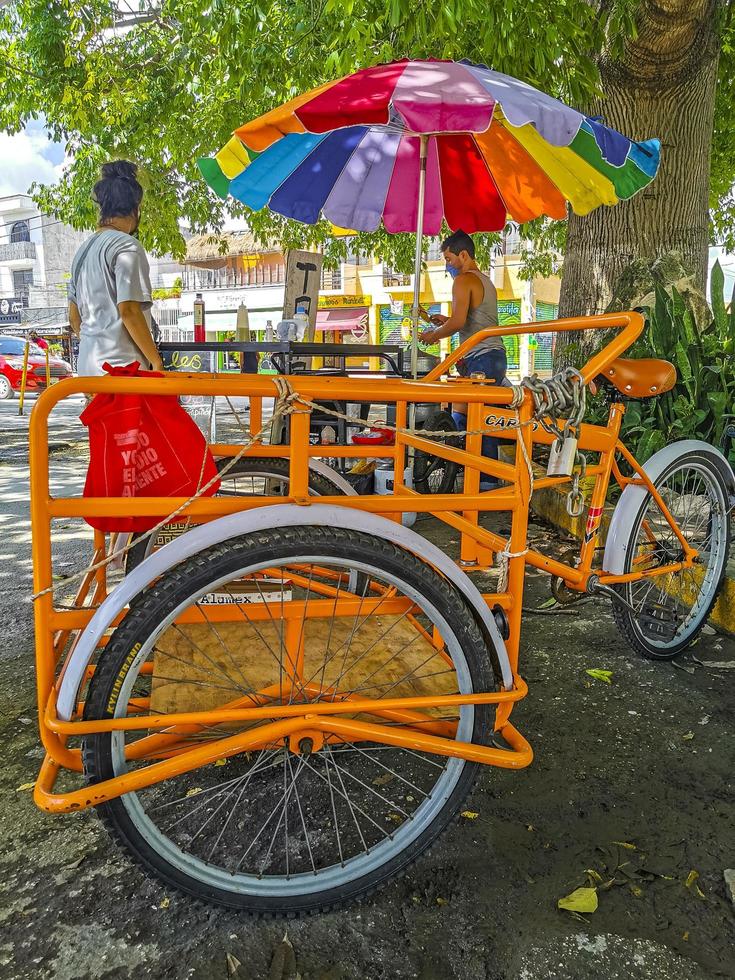 Playa del Carmen Quintana Roo Mexico 2022 Orange tricycle bike in Playa del Carmen Mexico. photo