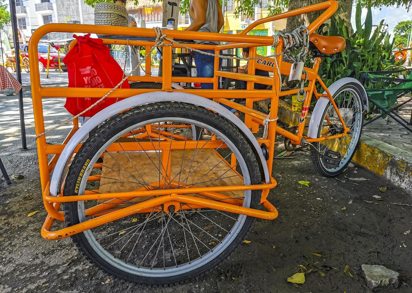 Playa del Carmen Quintana Roo Mexico 2022 Orange tricycle bike in Playa del Carmen Mexico. photo