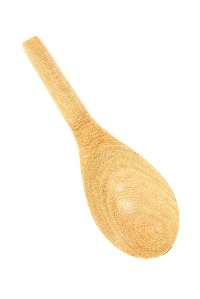 Wooden spoon on White background photo