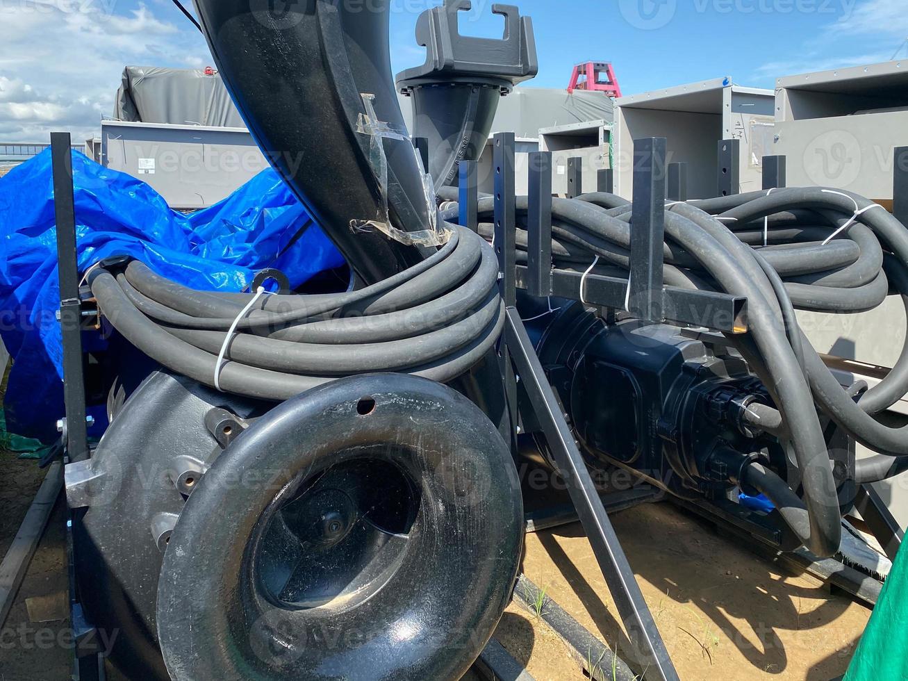 A large pump with an impeller and an impeller stands in a storage warehouse prepared for installation of industrial metal equipment for an oil refinery and petrochemical plant photo