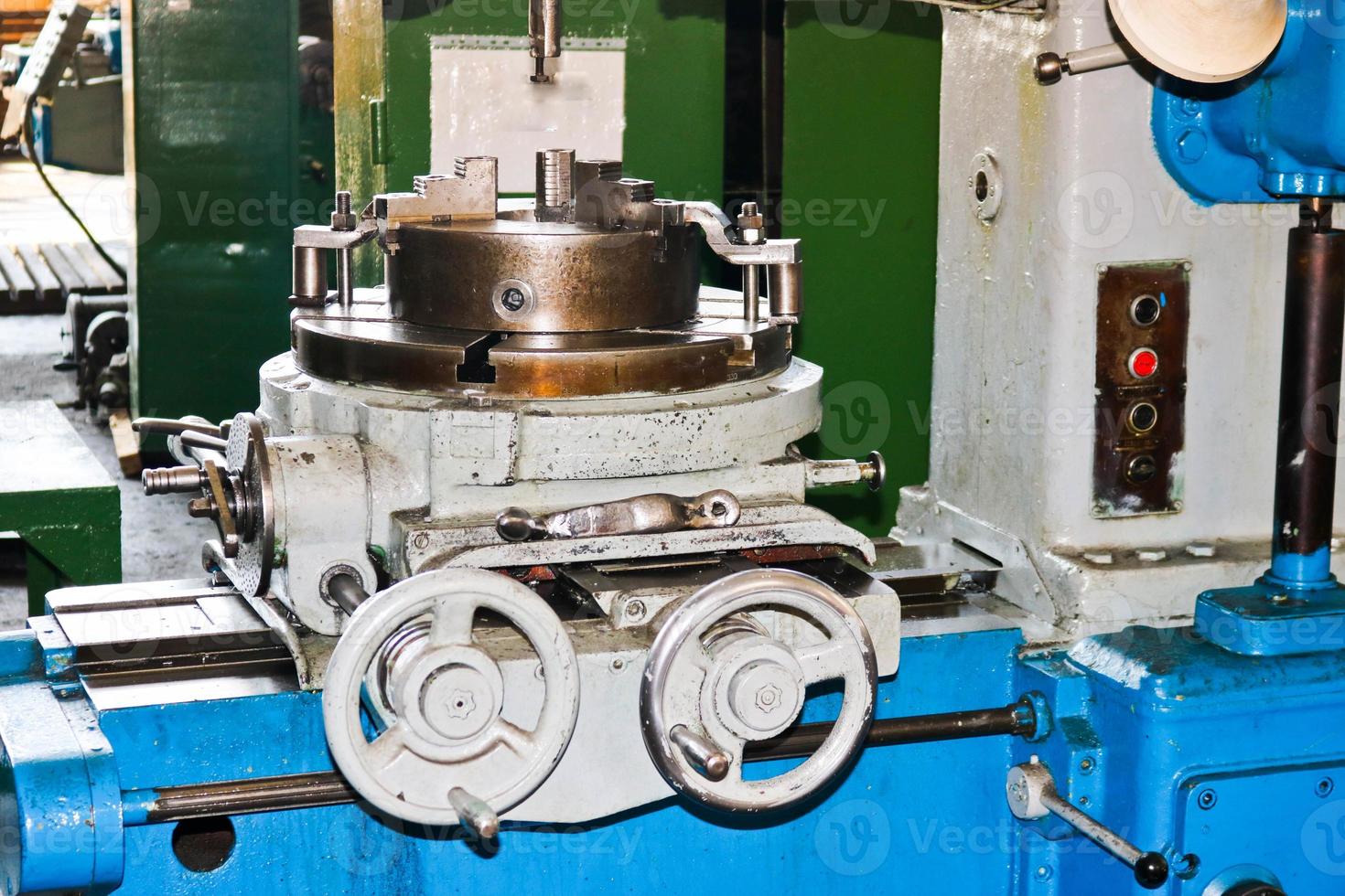 Industrial iron lathe for cutting, turning of billets from metals, wood and other materials, turning, manufacturing of details and spare parts at the factory photo