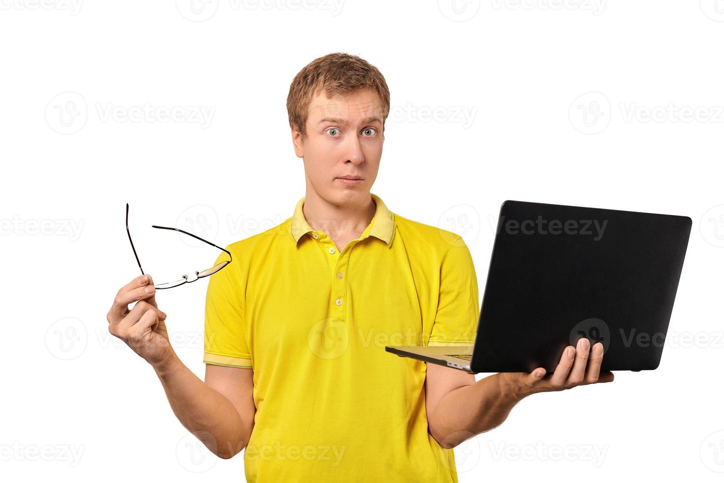 Puzzled male with notebook and glasses in hands isolated on white background, funny puzzled look photo