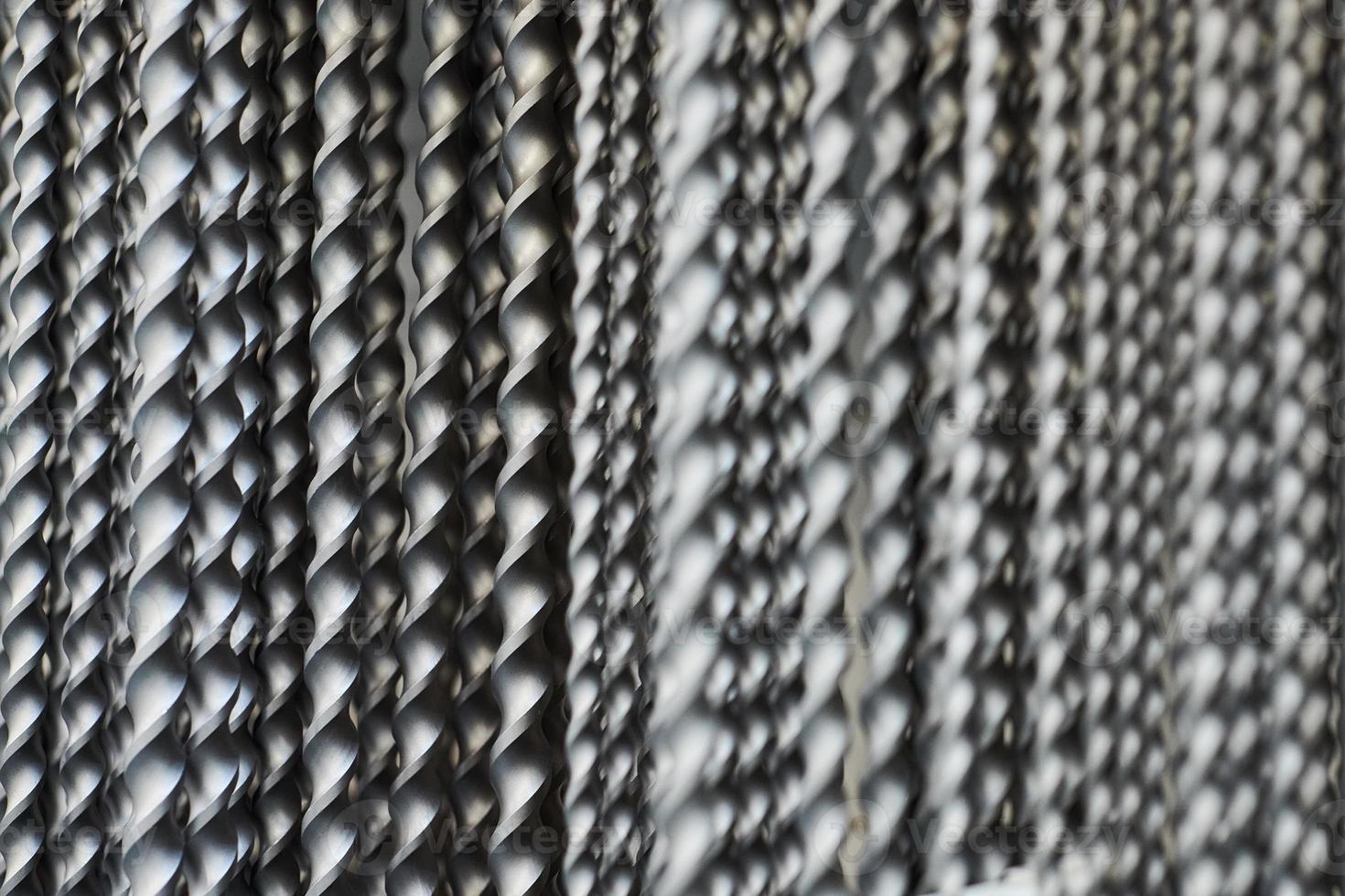 Hammer drill bits in hardware store background, small depth of field, construction tool photo