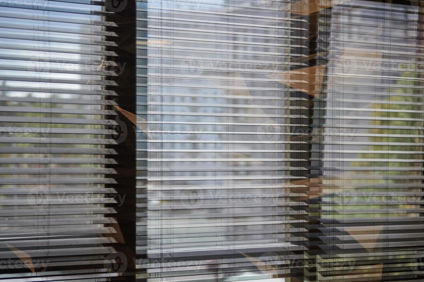 Office blinds. Modern wooden jalousie. Office meeting room lighting range control. photo