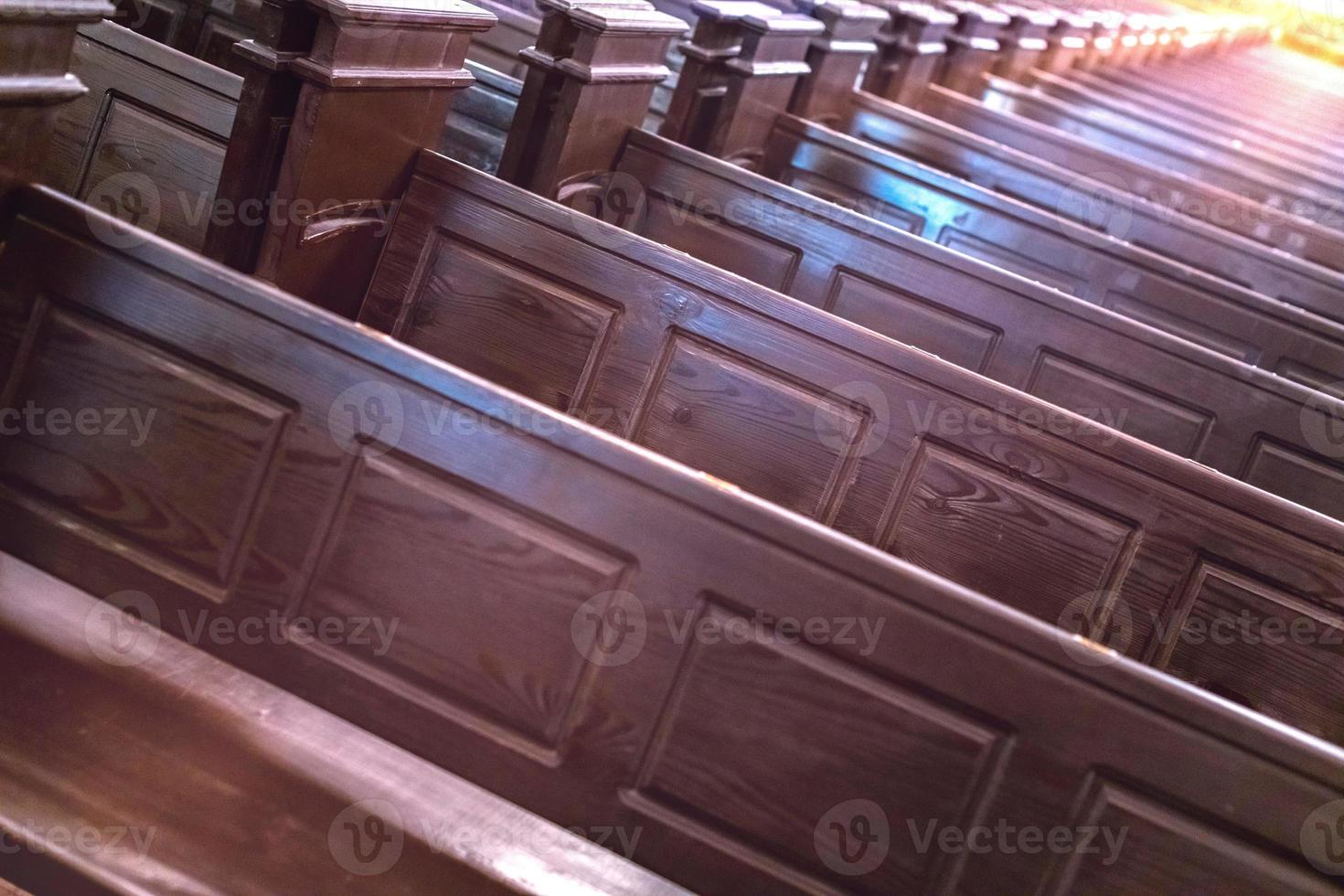 Cathedral benches. Rows of pews in christian church. Heavy solid