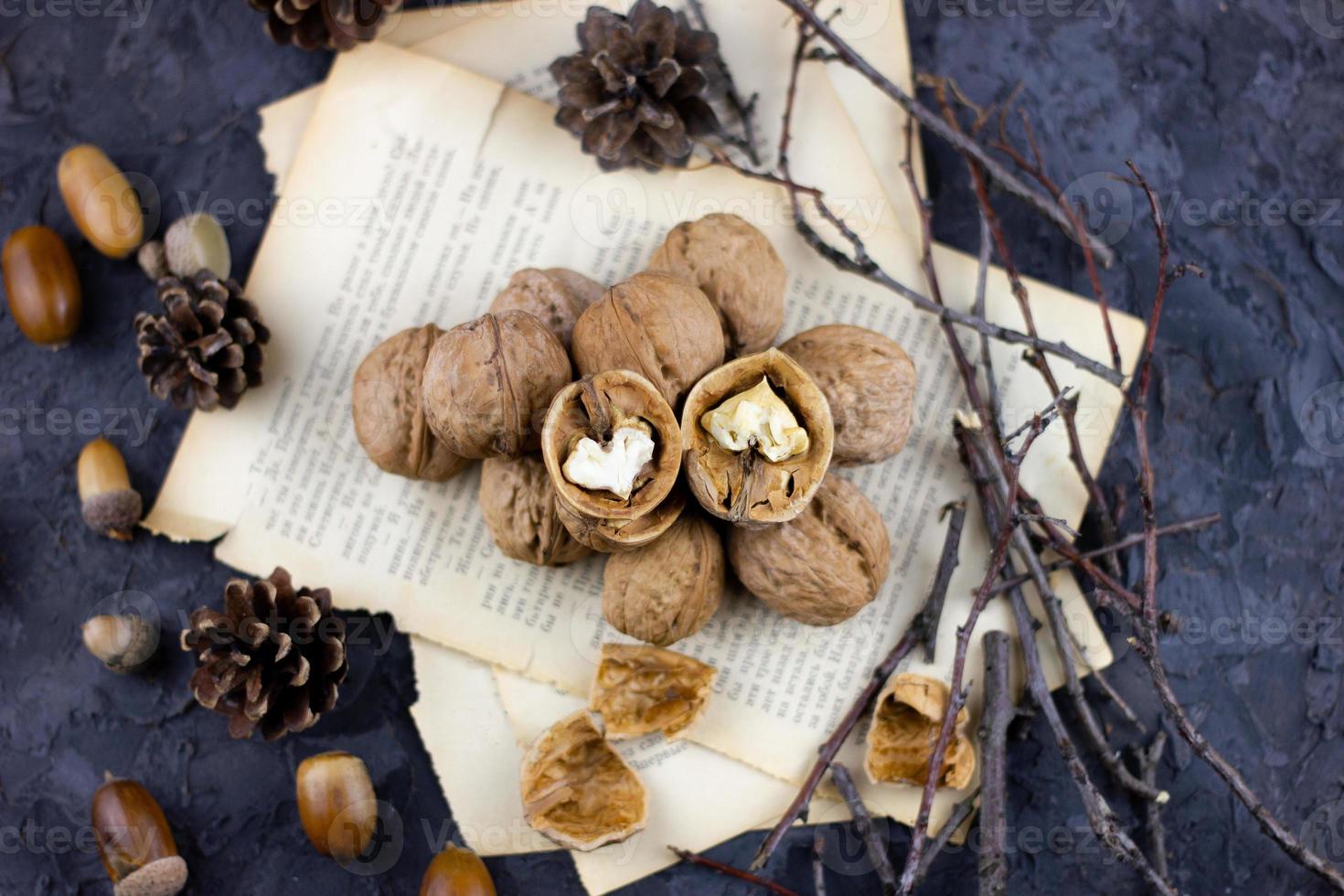 a group of walnuts on a dark background, a concept for the winter season. photo
