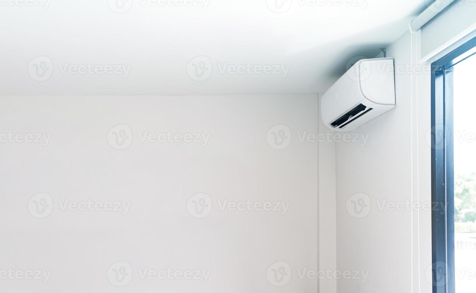 Air conditioner on white wall photo