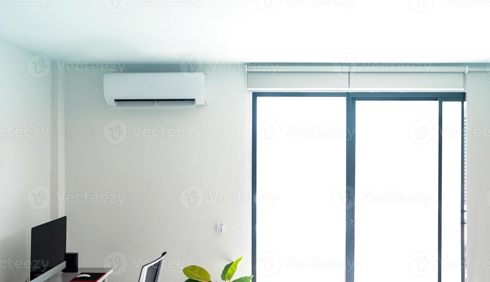 Air conditioner on white wall photo