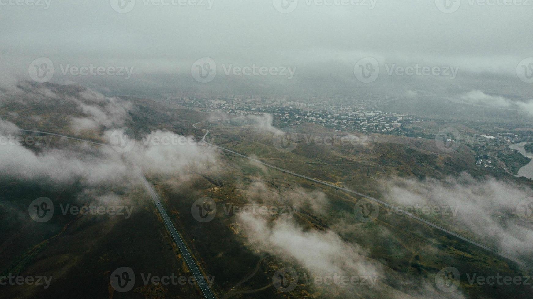 car moves in fog top view photo