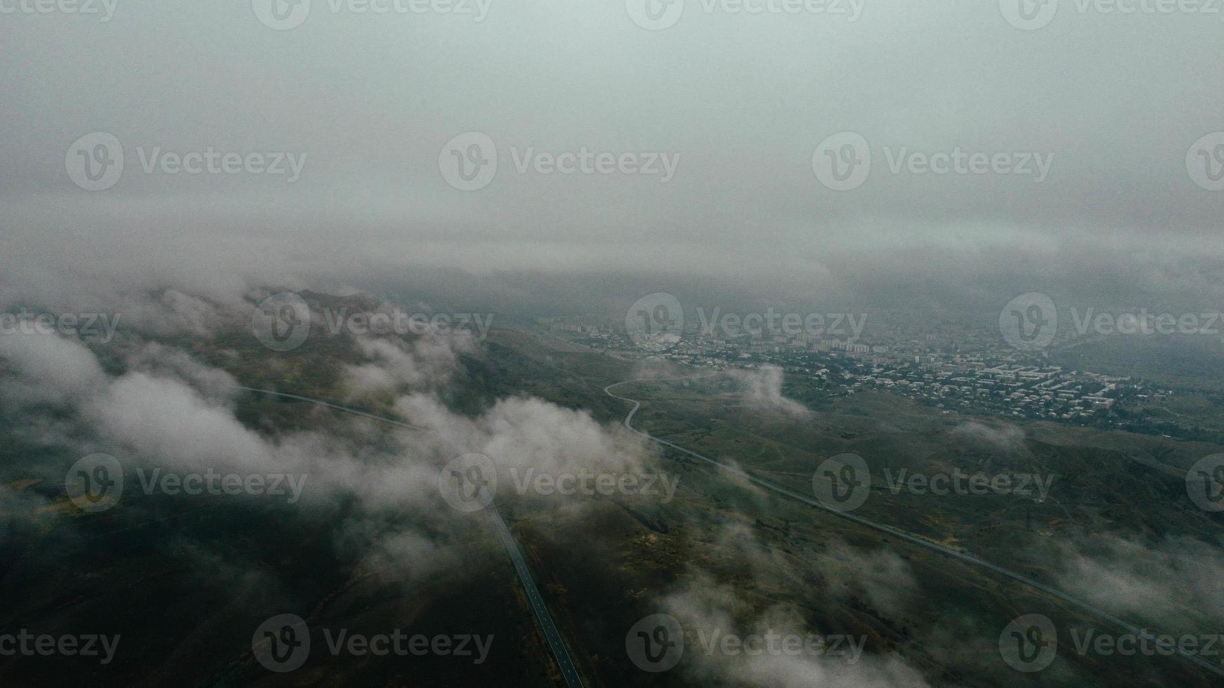 car moves in fog top view photo