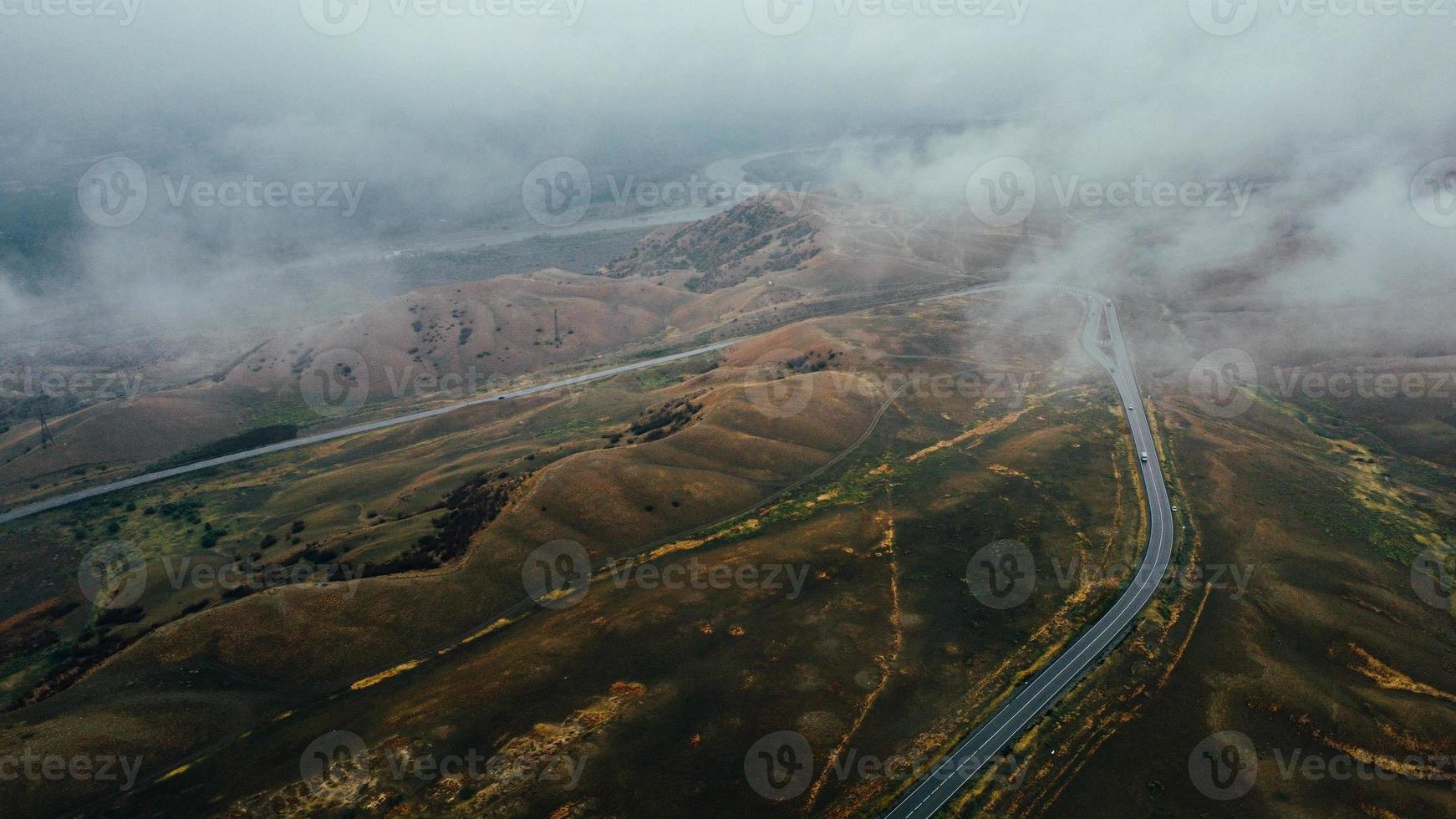 car moves in fog top view photo