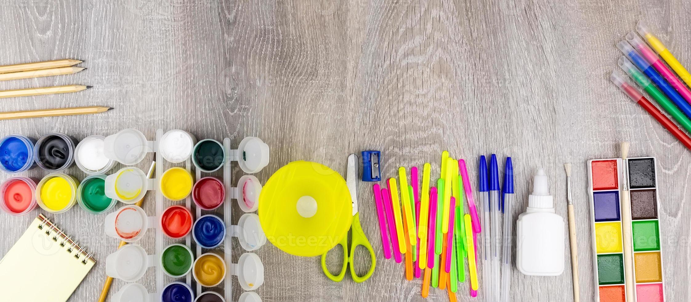 School supplies on a grey background photo