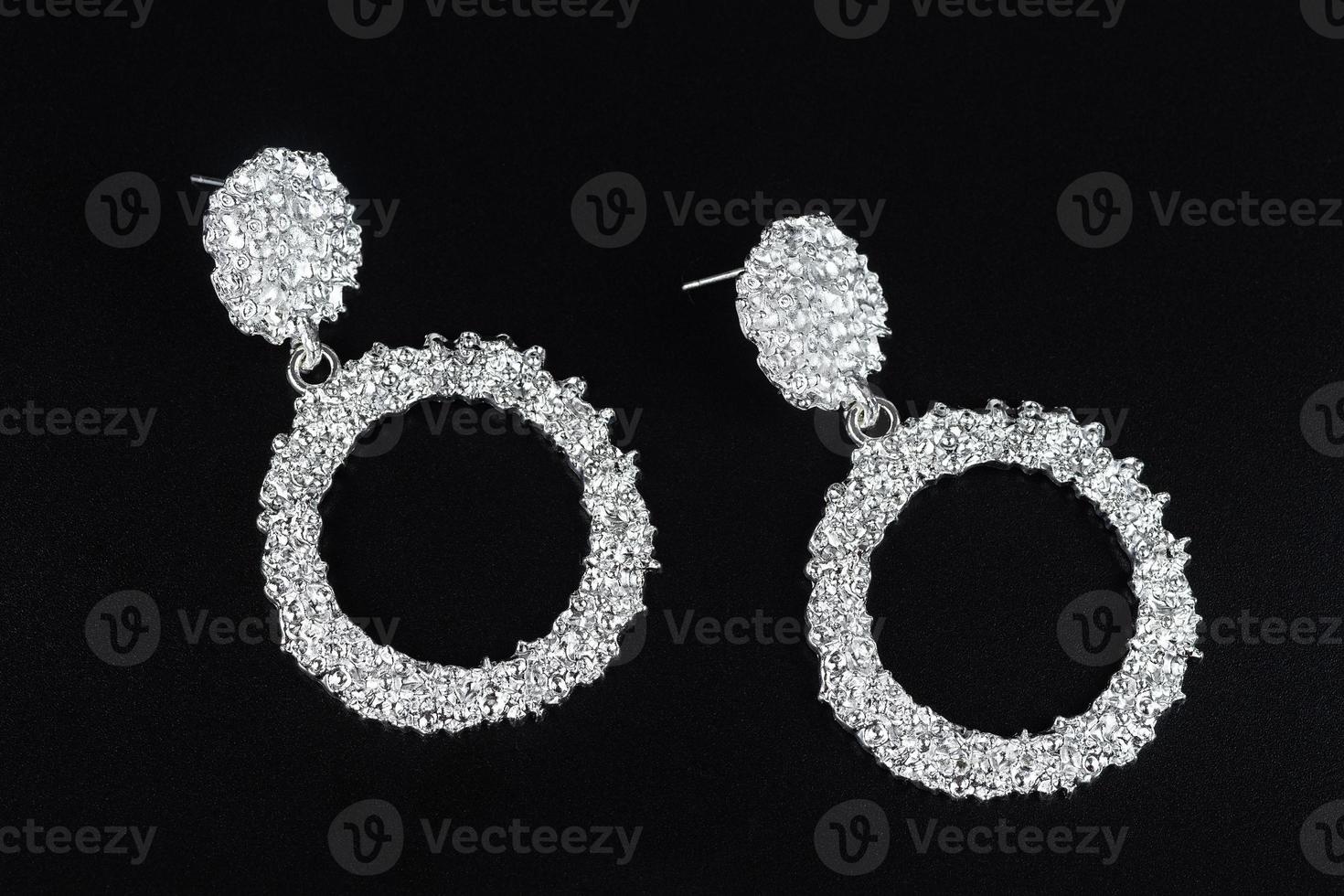 Jewelry earrings and costume jewelry on a black background photo