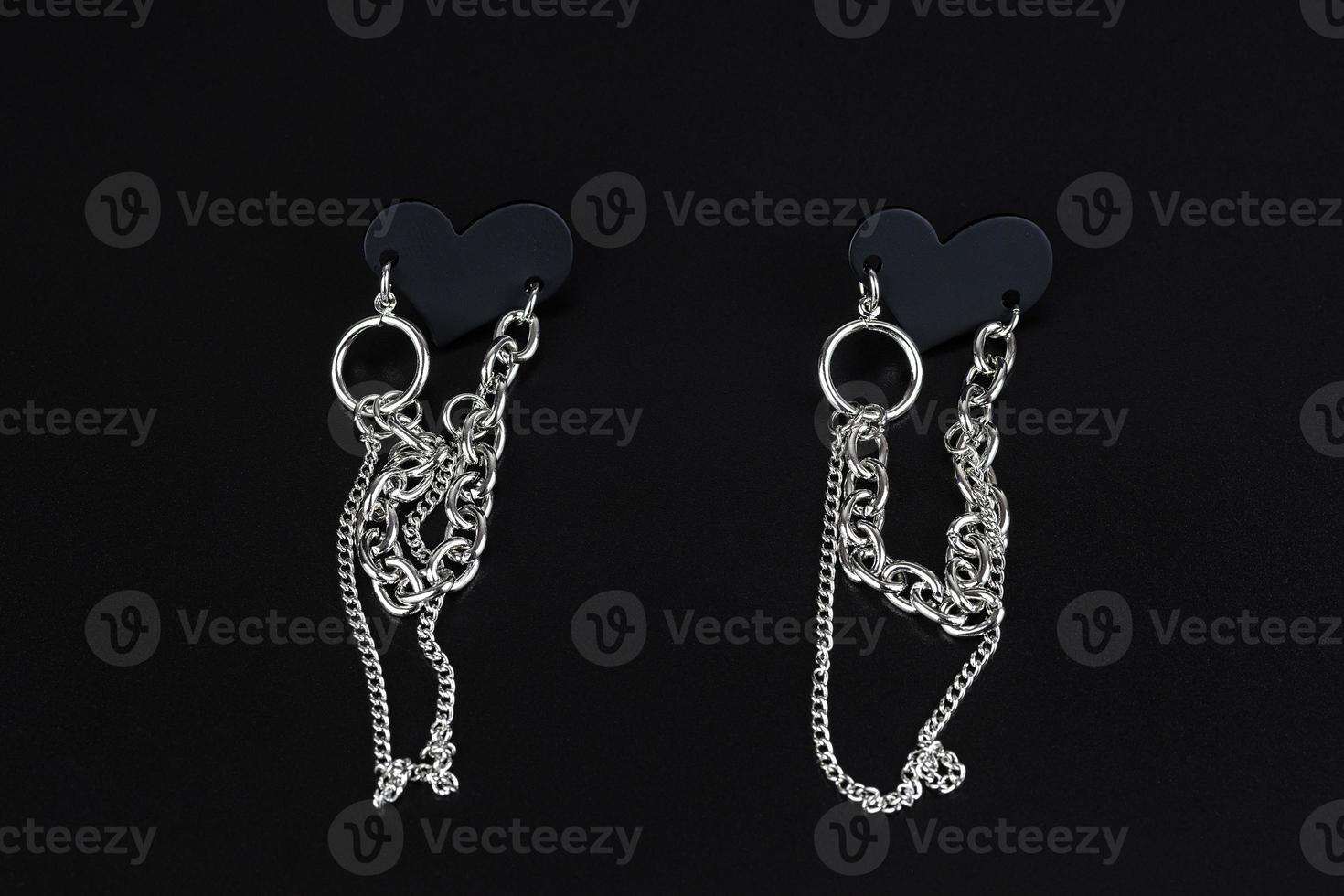 Jewelry earrings and costume jewelry on a black background photo