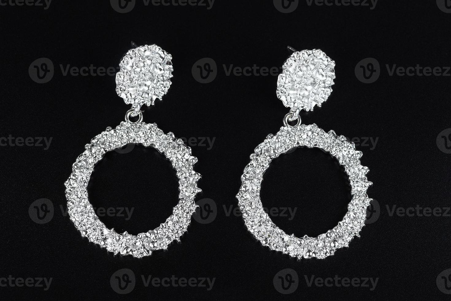 Jewelry earrings and costume jewelry on a black background photo