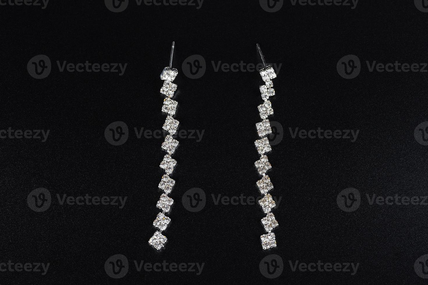 Jewelry earrings and costume jewelry on a black background photo