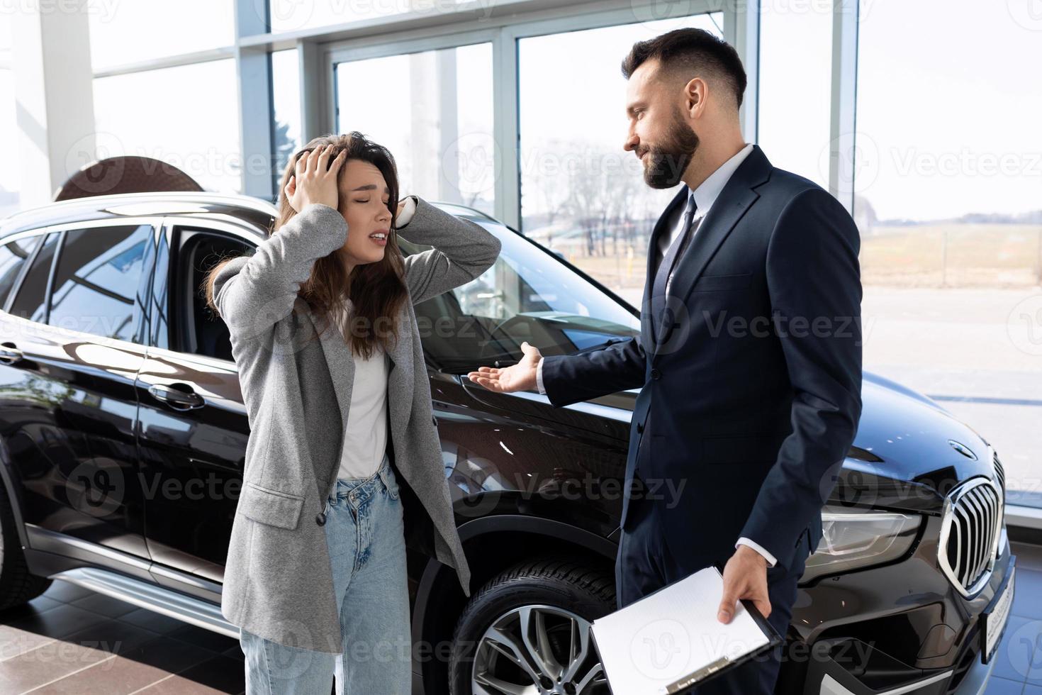 Angry customer at car dealership talking to car dealer, car insurance