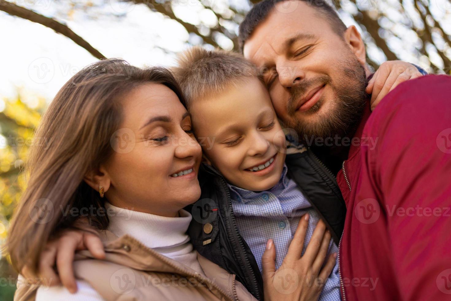 photographs of a happy traditional family closeup portrait of mom dad