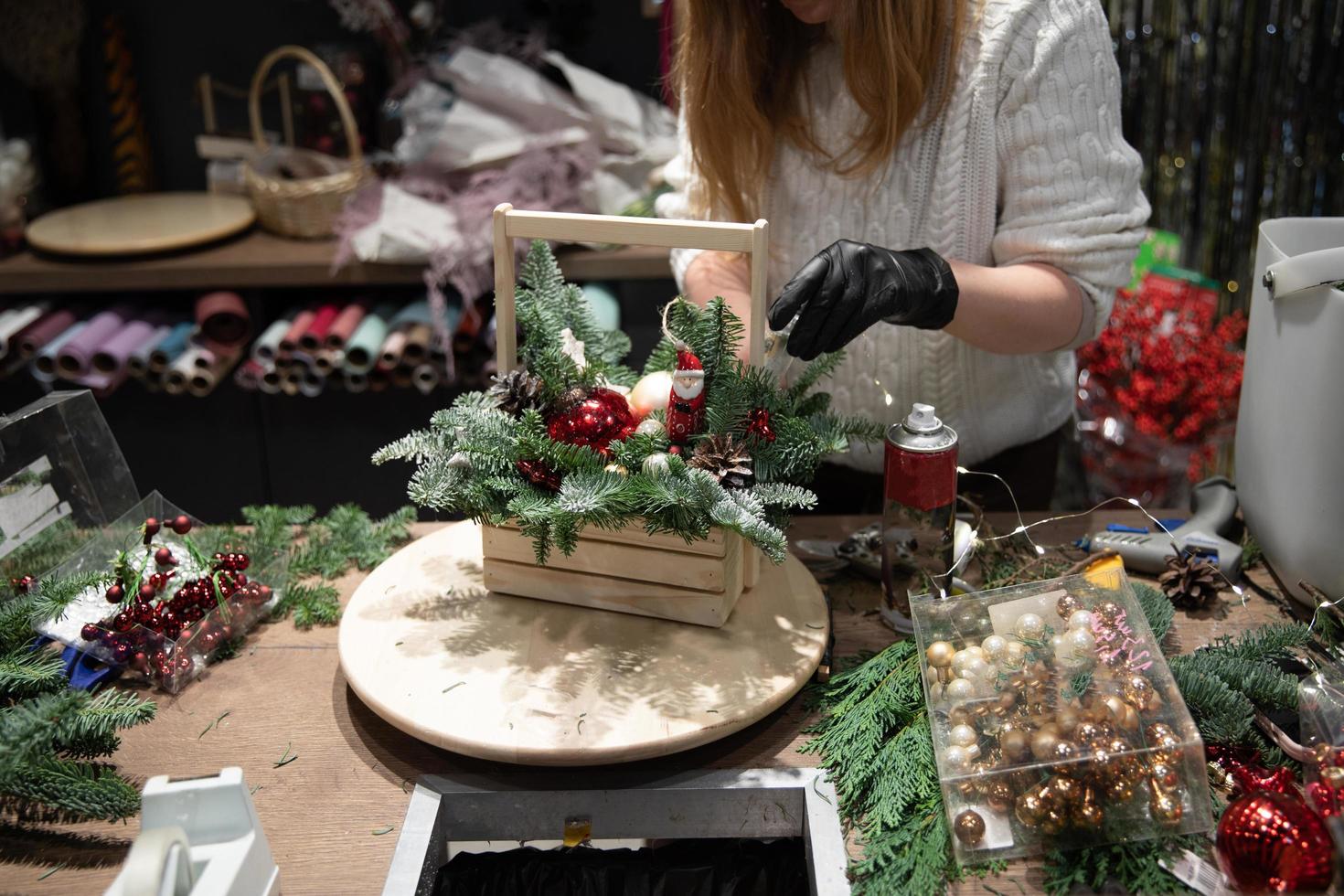 new year flower arrangement, florist at work in flower shop photo