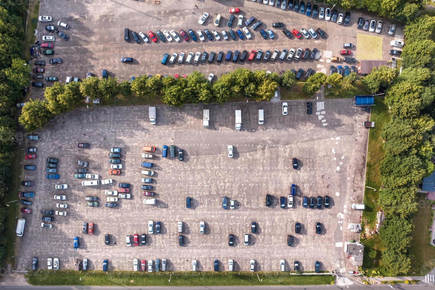 aerial view on large open air parking lot for cars for residents of area photo